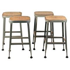 Set of 4 Adjustable Patinated Steel Counter Stools by Lyon Manufacturing
