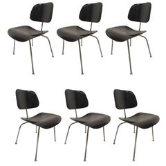 Six Mid-Century Black Lacquer Chairs by Charles Eames