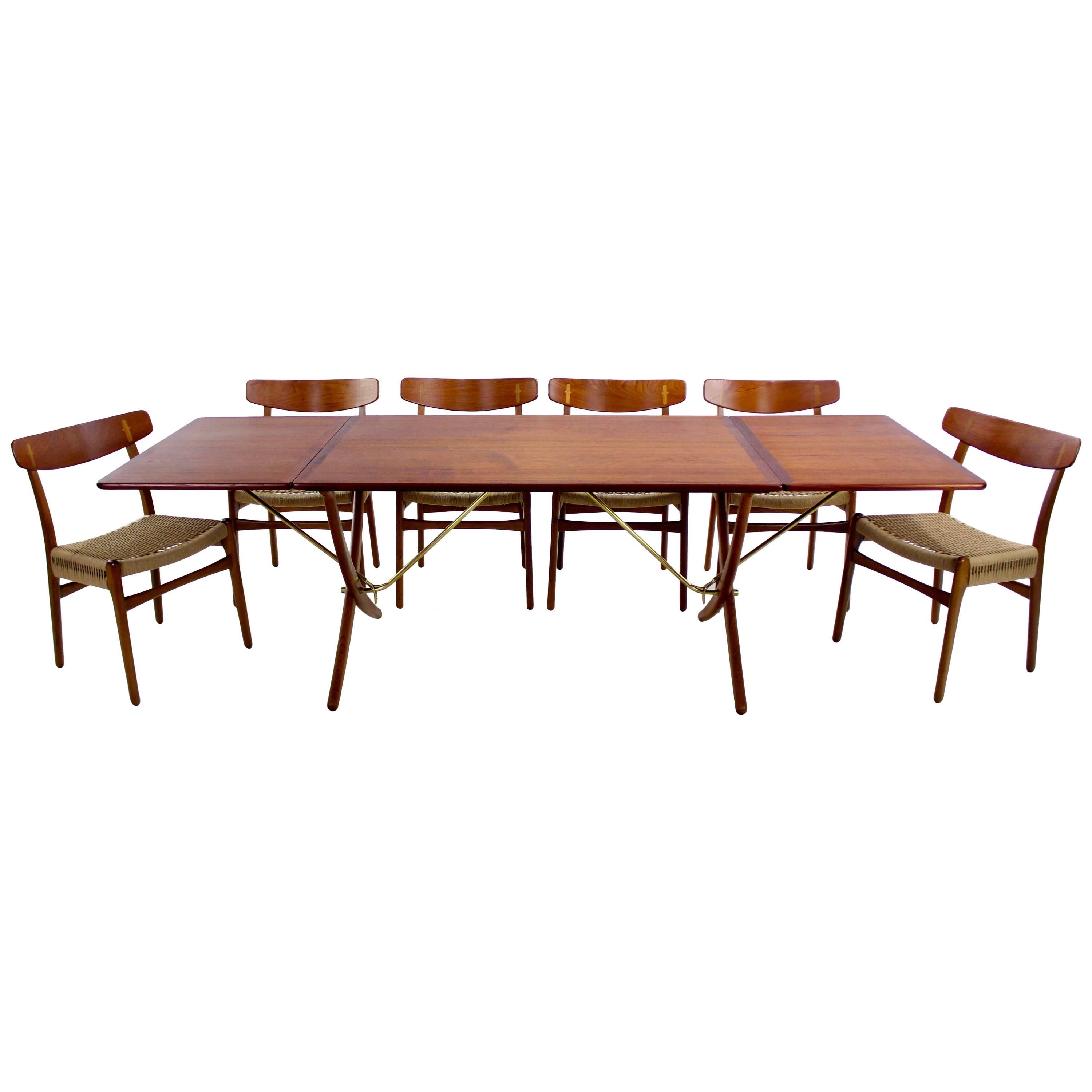 Danish Modern Six Chair Drop Leaf Dining Set Designed by Hans Wegner For Sale