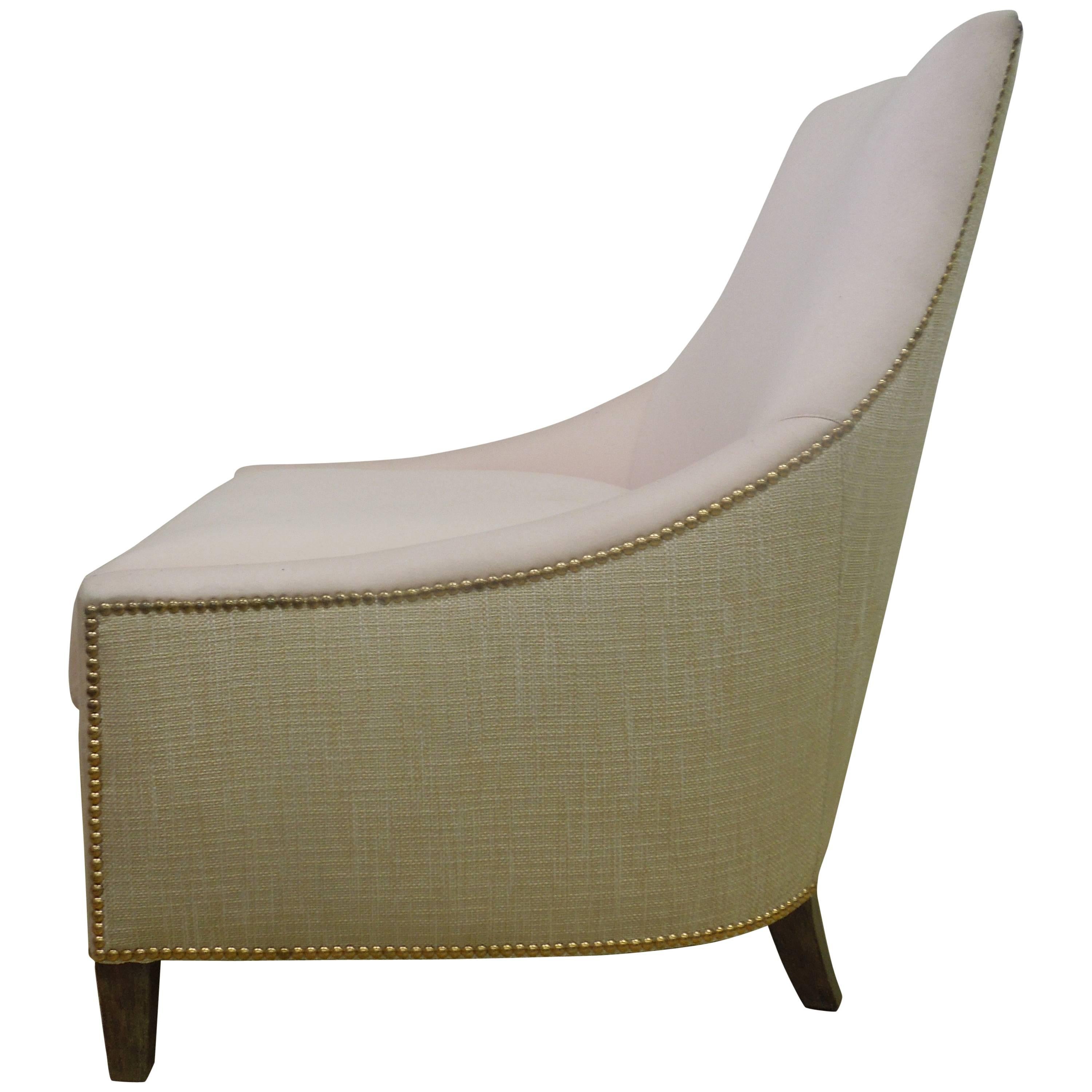 A custom-made chair on tan linen and pink wool blend fabric. Exterior is all tan linen. Interior all pink. Beautiful brass nailhead trim on back. Grey or tan wood legs. Handcrafted in Los Angeles from upscale maker. Came with matching 