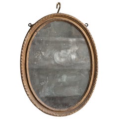 Small Carved Giltwood Oval Mirror, Early 19th Century
