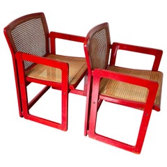 Used A pair of mid century modern Italian chairs in a red lacquered wood and cane