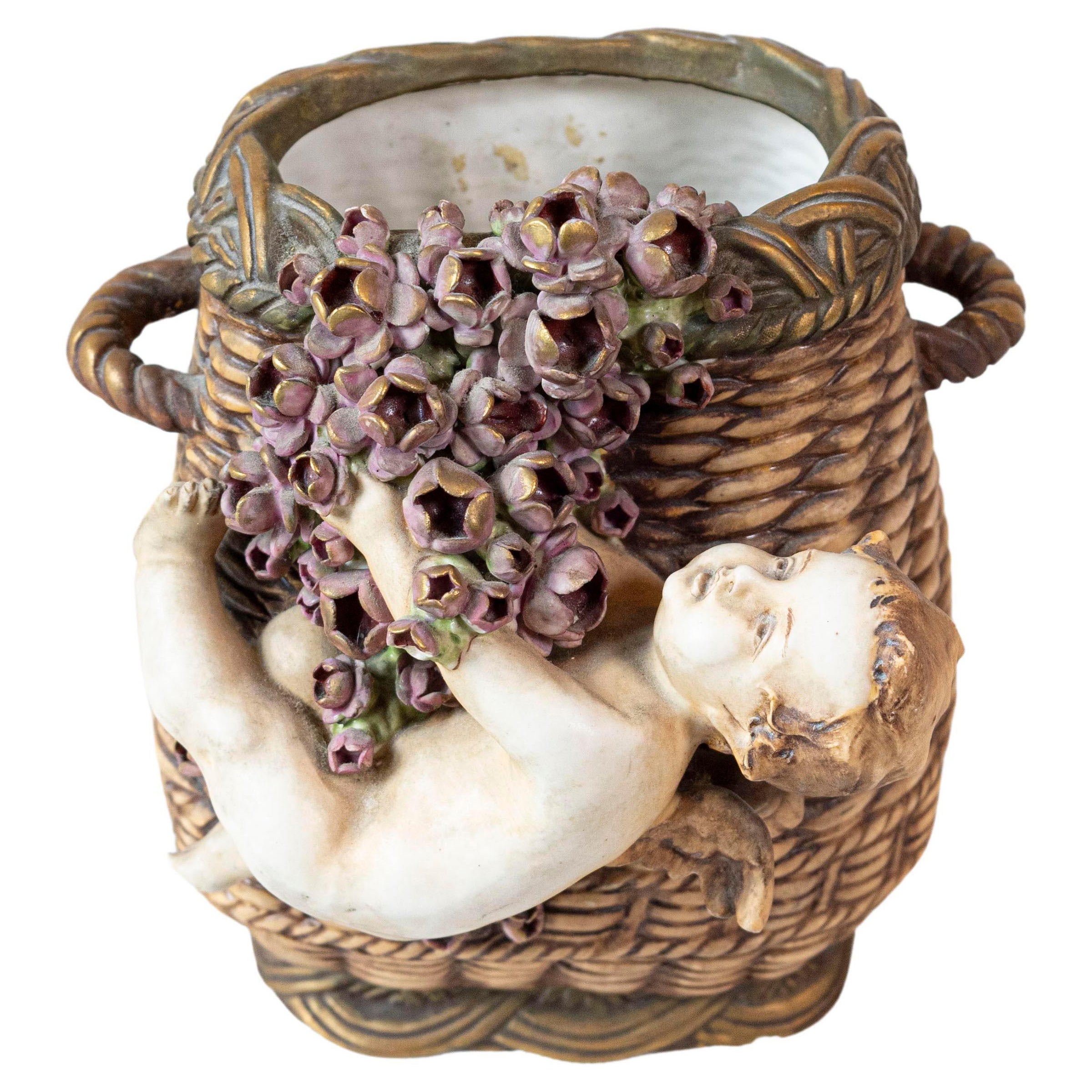 French Painted Terracotta Wicker Basket Vase with Cherub Swinging from Roses