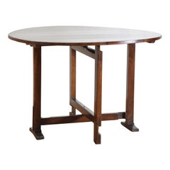 French Solid Walnut Folding Oval Vineyard Table from the mid 19th century