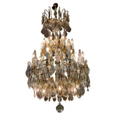 Large bronze and crystal chandelier with clear and lavender crystals