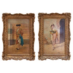 Paire de peintures andalouses en bois encadrées des années 1850 représentant un torero et une femme