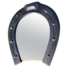 1950's Stitched Leather horse shoe mirror by Jacques Adnet