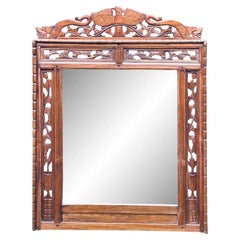 Antique miroir mural indonésien en teck sculpté à la main avec ajourés