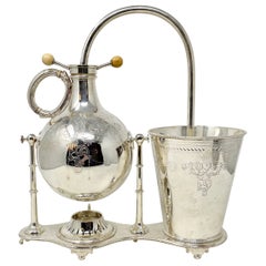 Antigua cafetera de sifón inglesa chapada en plata, circa 1870.