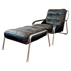 A bauhaus style black leather and chrome lounge chair and ottoman
