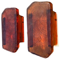 Pair of wall lamps in cast amber glass and brass. By Vitrika in Denmark 1970ties