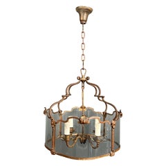 Rare 4 lights gilt beaten wrought iron lantern with curved glasses. French work.