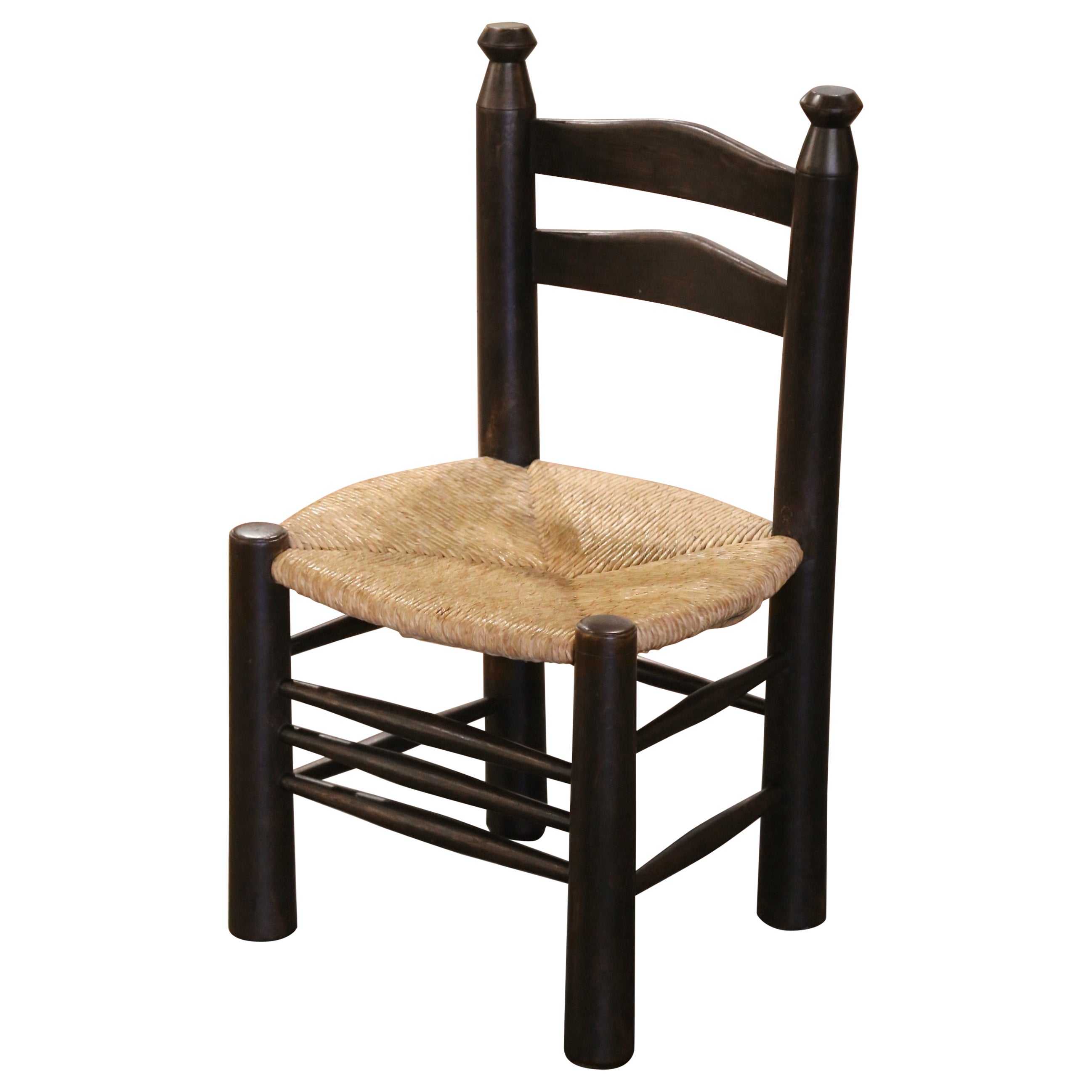 Early 20th Century French Carved Walnut Child Chair with Rush Seat