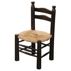 Early 20th Century French Carved Walnut Child Chair with Rush Seat