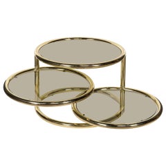 Mesa circular "giratoria" de tres pisos de latón y cristal del siglo XX, de Milo Baughman c.1970