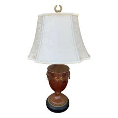 Brown and Gold Neoclassical Tole Lamp With Brass Lion Heads