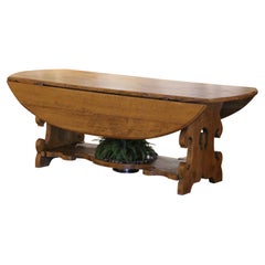 19th Century French Carved Oak Drop-Leaf Oval Table on Trestle Base