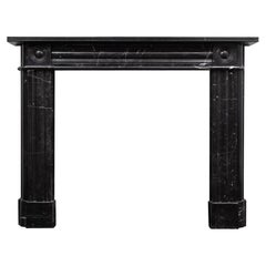 A 'Nero Marquina' marble fireplace of early 19th century design by RYAN & SMITH