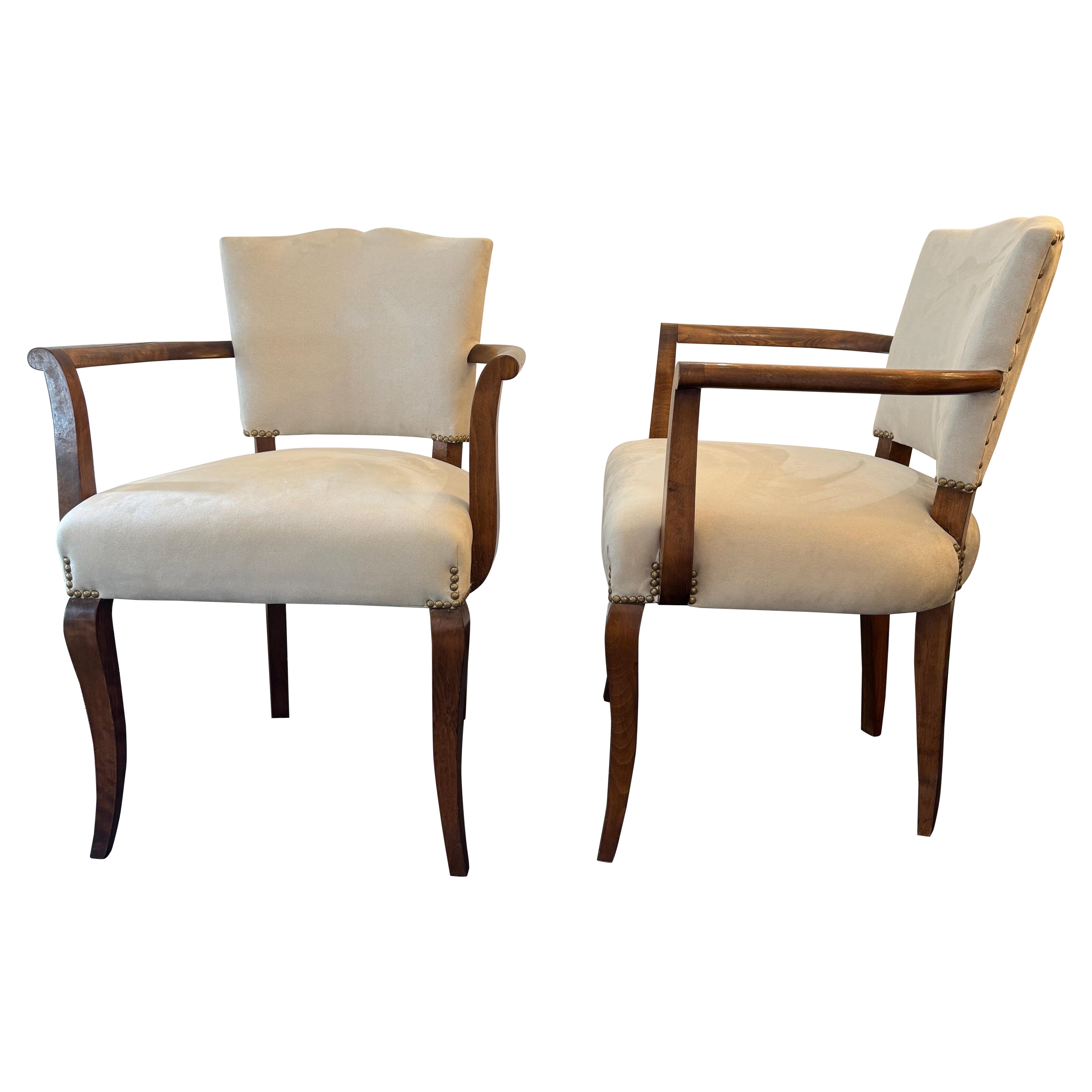 A pair of Italian walnut occasional chairs newly upholstered in velvet