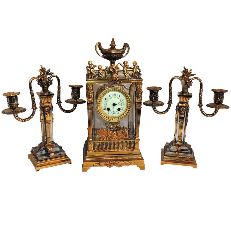 Wonderful French ThreePiece Gilt Bronze Crystal Glass Clock Set Suite