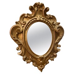 Espejo barroco vintage italiano florentino de madera dorada ornamentada