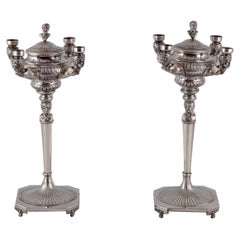 Pair of large and impressive Italian candlesticks in silver.