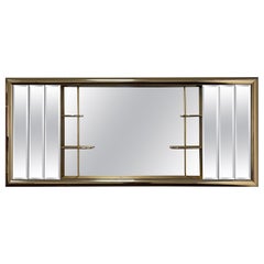 Miroir vitrine de style Jon Gilmore du milieu du siècle dernier