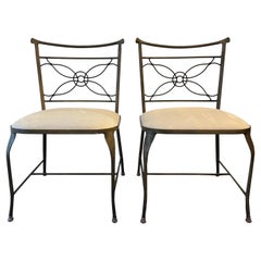 A rare pair of Rene Prou wrought iron occasional chairs