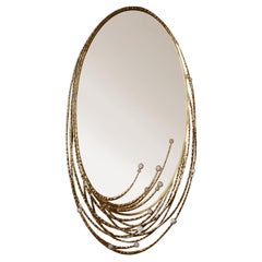 Oval bronze mirror by Studio Glustin