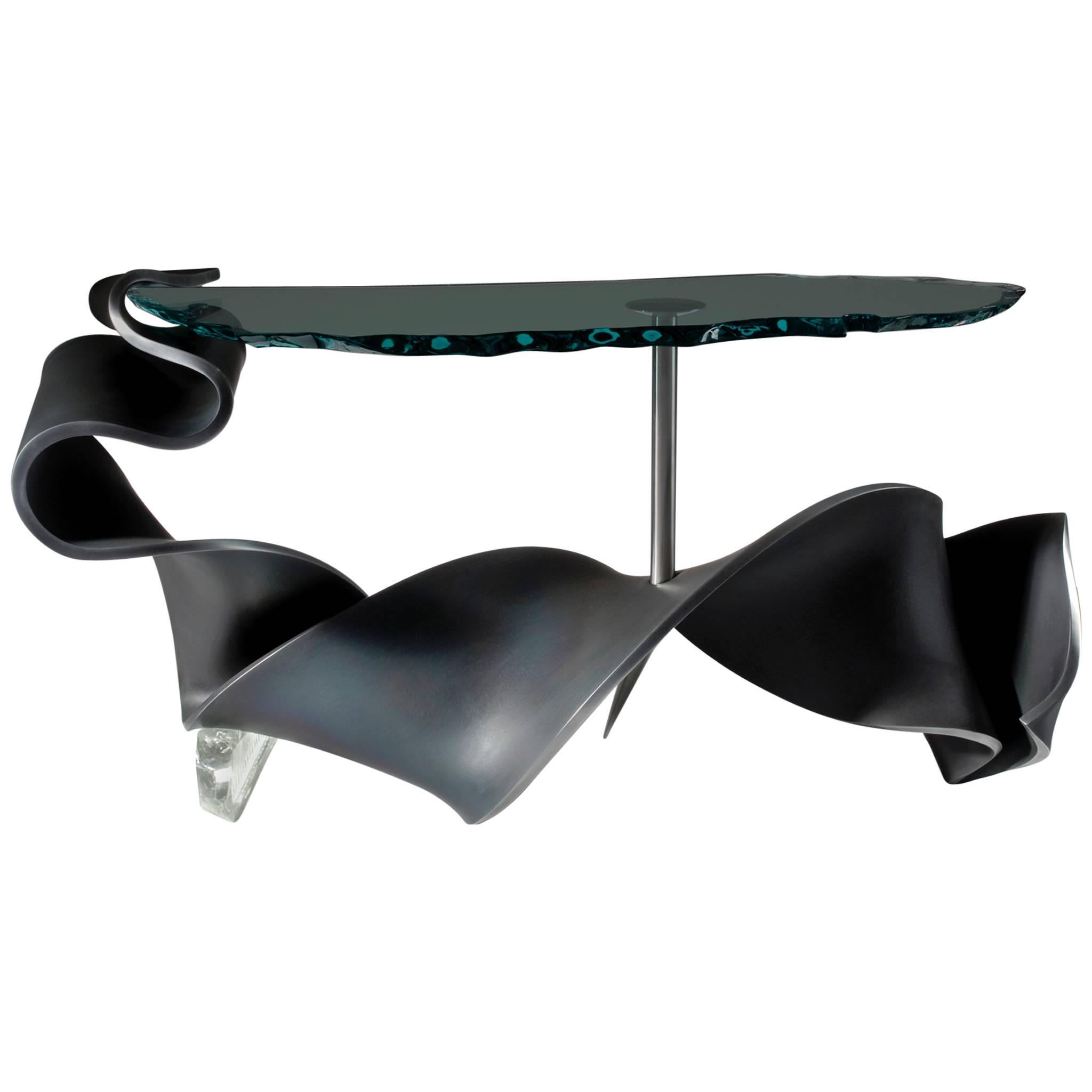 Snakespear
2007 
A unique console designed by American artist Danny Lane. 20mm thick mild steel, heat formed and blackened  with polished edge, pierced by forged stainless steel nail, supporting 25mm thick float glass with polished hammer