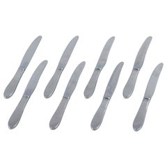 Gundorph Albertus per Georg Jensen. Otto coltelli da cucina Mitra in acciaio inossidabile