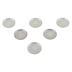 Georg Jensen, juego de seis posavasos de cristal en plata de ley. Model No. 51A.