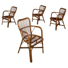 Quatre fauteuils italiens modernes du milieu du siècle dernier en rotin avec accoudoirs, années 1960
