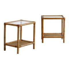 Pair of rattan bedside tables with rattan fabric and glass shelves, Italy 1980