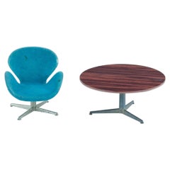 Miniatures of the "Swan" chair and Circular table designed by Arne Jacobsen.