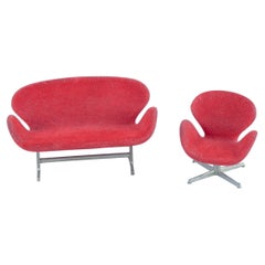 Miniatures of the "Swan" chair and sofa in red fabric, designed by Arne Jacobsen