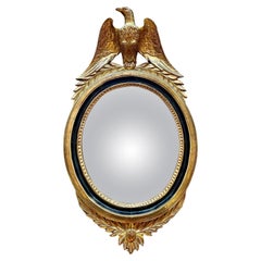 A French Gold Gilt Oval  Convex  Eagle Crested Mirror