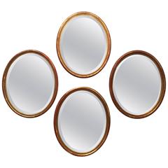 Antique Grouping of Four French Oval Beveled Gilt Mirrors