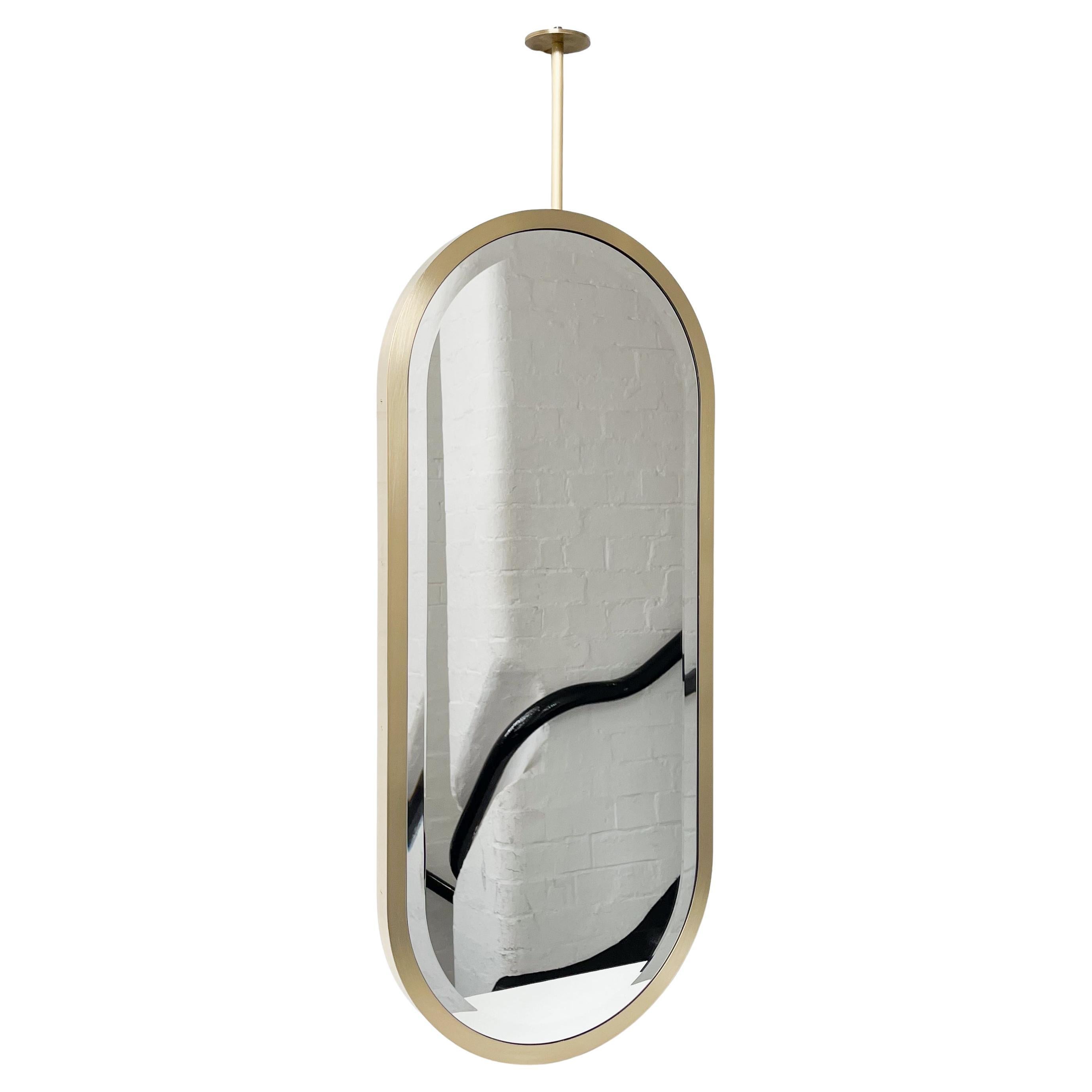 Modern Ceiling Suspended Capsula Pill shaped Bevelled Mirror with a Brass Frame