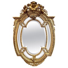 Antique French Carved Gold-Leaf Mirror with Beveling, Circa 1875-1895.