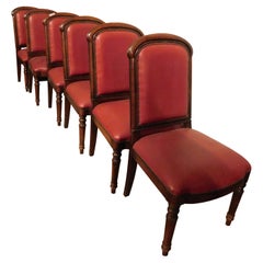 set of 6 walnut armchairs, upholstered in red leather, from an Italian theater