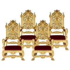 Set of Four Baroque Style Carved Giltwood and Velvet Throne Armchairs