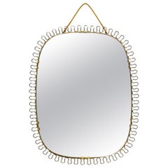 Beautiful small heavy original Mid Century brass wall mirror in loop design