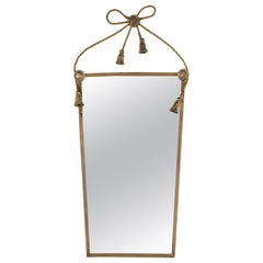 Italian brass bow and tassels mirror. mid-century