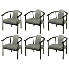 Six Slate Grey Linen Upholstered and Ebonized Yoke Arm Dining Chairs