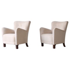 Paire de fauteuils tapissés en pure alpaga