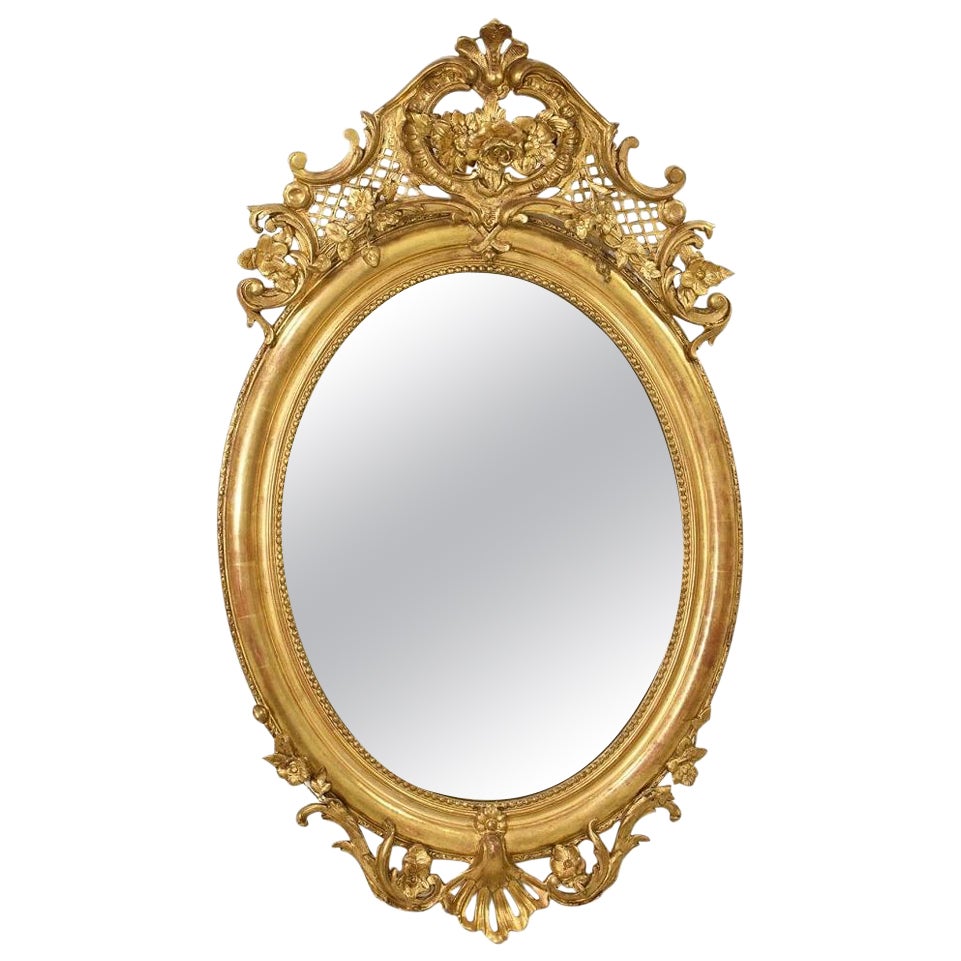 Miroir ovale ancien avec Cimasa et fleurs, doré à l'or pur, 19e siècle.