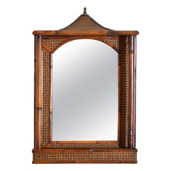 English Rattan, Faux Bamboo, and Brass Pagoda Shaped Mirror with Storage Area