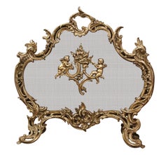 Écran de cheminée en bronze doré Louis XV du XIXe siècle avec motifs de chérubins