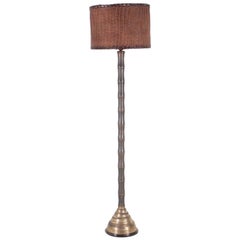 Brass and wicker floor lamp